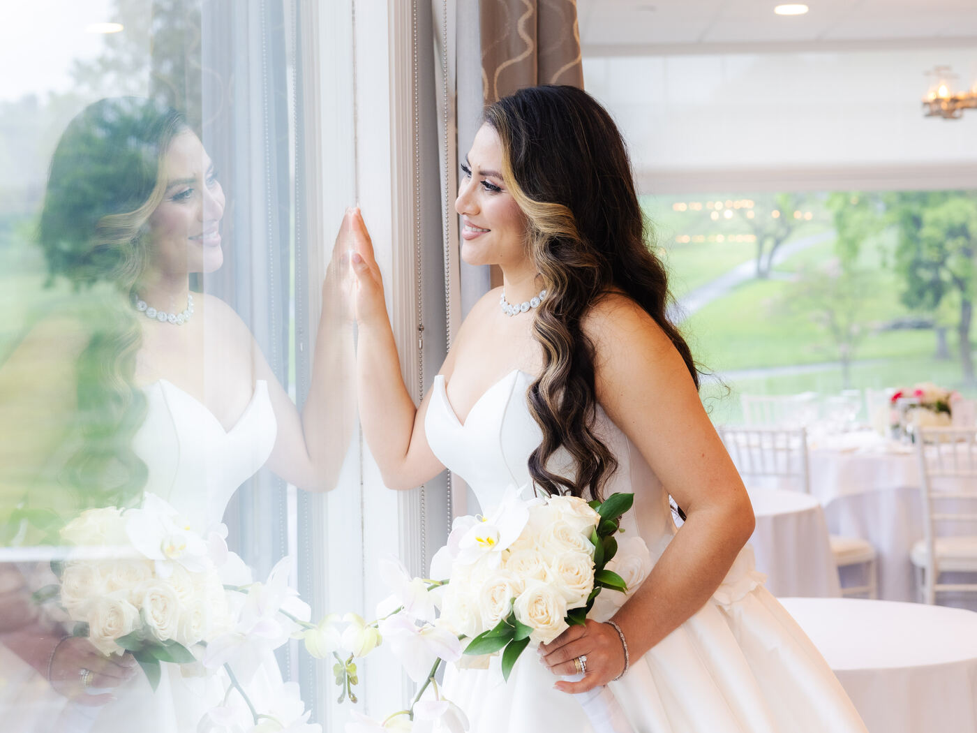 Bride by the window at a luxury venue