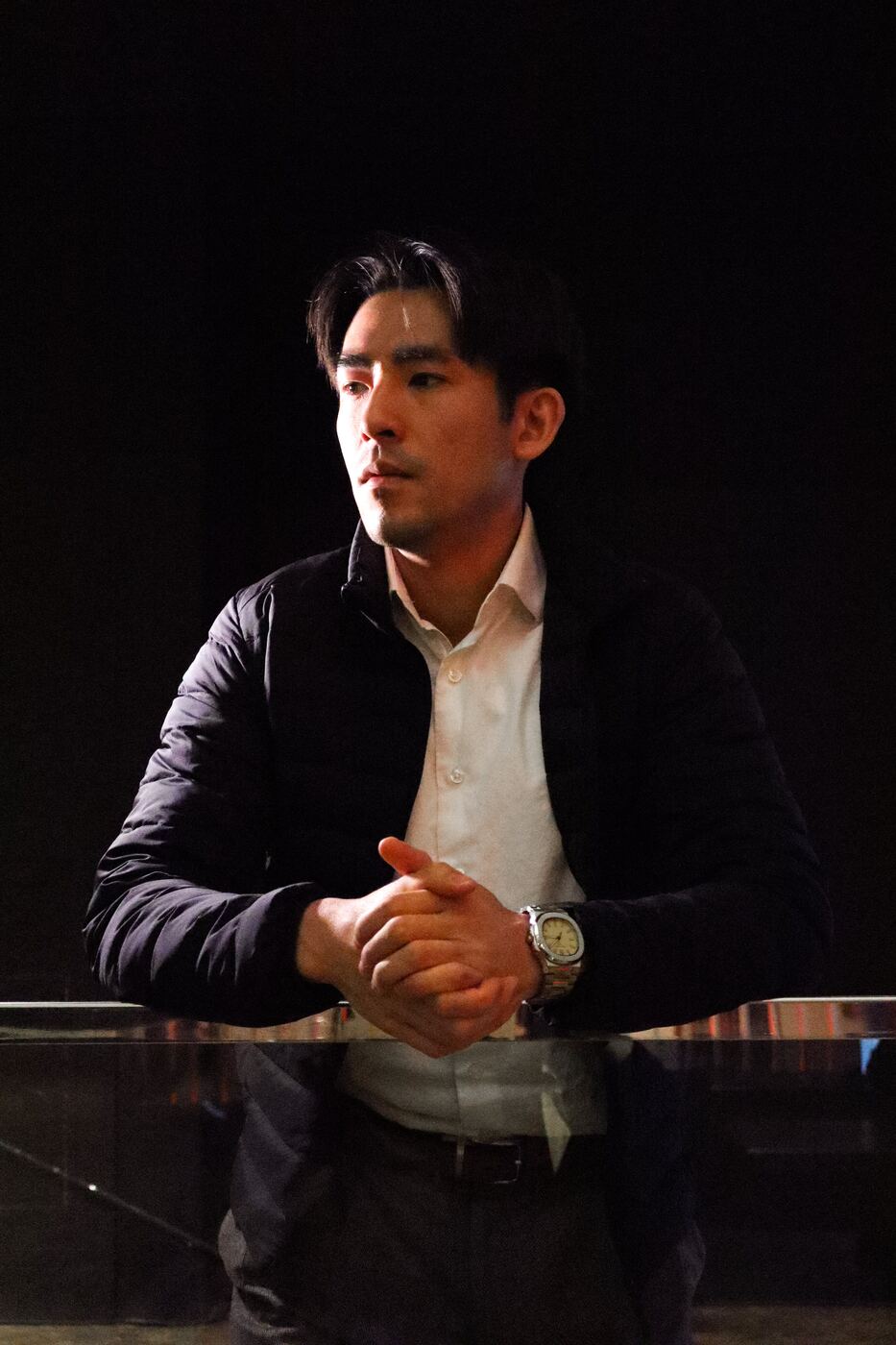 Executive in low-key light